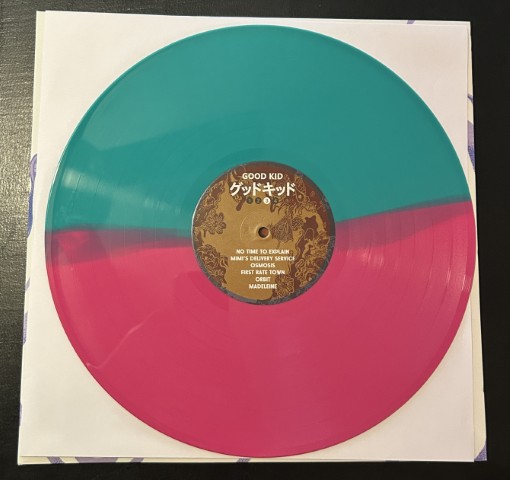 Sides C and D of the Good Kid vinyl in bright cyan and magenta.